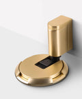 No Fuss Adjustable Bottom Door Stopper With Slick Brushed Gold Finish installed on a floor, showcasing easy-install mechanical design.