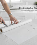Self Adhesive Wallpaper Roll Subtle Gray Linen Texture Waterproof Vinyl Peel and Stick Film being cut for drawers.