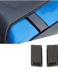 Slick Carbon Fiber Top Screws Protector Cover Trim Cap For 2021 Plus Vehicles on a blue surface showing sleek design and fit.