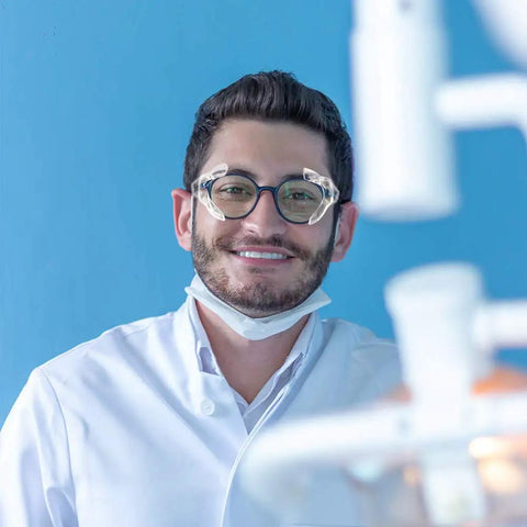 Smiling person wearing glasses with Three Six Ten Pack Eye Glasses Side Shields Slip On TPU Guards For Safety Glasses.