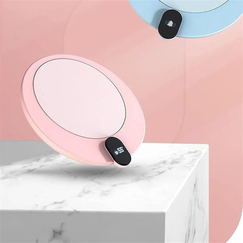 Compact Desk Coffee Warmer With Auto Shut Off And Waterproof Aluminum Base keeps drinks warm on a marble surface, pink design.