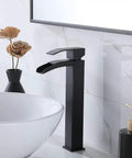 Dope Sleek Black Vessel Sink Faucet With Waterfall Spout And Single Handle, shown installed with pop-up drain in modern bathroom.