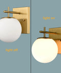 Gold Globe Wall Sconces Set of Two, Dope Brass Modern Vanity Lights With Milky White Glass Shades shown on and off, brushed brass finish