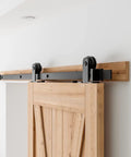 5 Ft Top Mount Sliding Barn Door Hardware Kit For 26 To 30 Inch Doors installed on wooden door with black rail