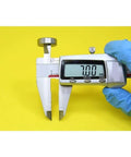 Digital caliper measuring 7mm with blue-gloved hand, ideal for precision assessment of Heavy Duty 607 Hybrid Ceramic Ball Bearings.