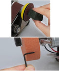 Person using the Stainless Steel Electric Belt Sander Grinder Machine With Adjustable Work Table Shockproof Feet for polishing.