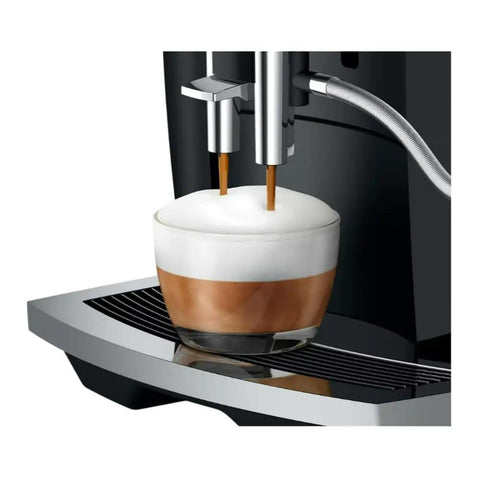 Straight Up Game Changing Automatic Espresso Machine With 2.8 Inch Color Display And Easy Cappuccino Function In Piano Black brewing a cappuccino.