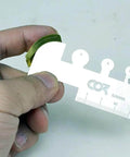 Close-up of Photo Etched Hobby Etching Kit With Stainless Steel Sheet Bender Tool, showing details of ruler use.