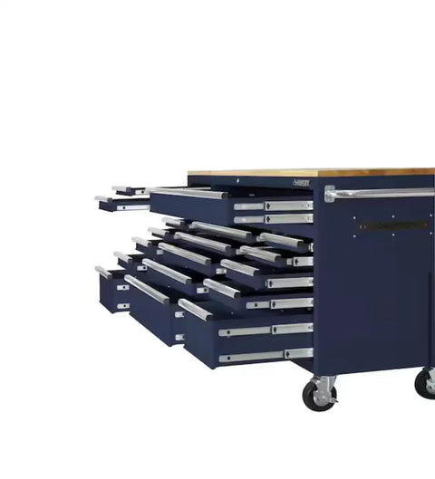 Badass 72 Inch Wide Mobile Workbench Tool Chest With Solid Wood Top Integrated Power Strip And 18 Hella Spacious Drawers For Rock Solid Gloss Blue Garage Storage showing multiple drawers open.