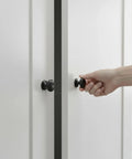 Hand opening door with Matte Black Large Bifold Closet Door Knobs Four Pack With Renovation Ready Wide Base Zinc Round Kitchen Wardrobe Dresser.