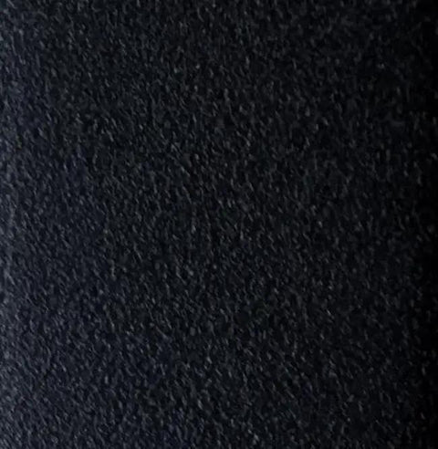 Close-up of a textured black surface, emphasizing the smooth finish for 48 Inch Low Profile Shower Drain Complete Installation Kit.