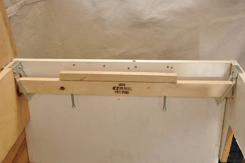 Undermount Sink Bracket Kit 10 Pack For Solid Surface Countertops installed on wooden frame showing mounting hardware