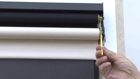 Adjusting AM25 12V DC Tubular Roller Blind Motor With Built In Limit Switch using Allen wrench, showing installation for RV shades.
