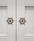 Two doors with Vintage Ship Wheel Anchor Cabinet Pulls Set Of 4 For Dressers And Wardrobes Nautical Style Decorative Handles installed.