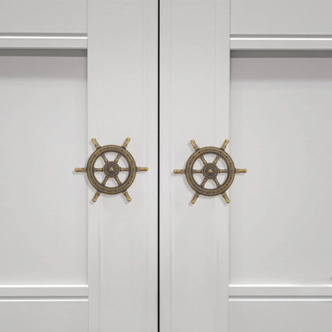 Two doors with Vintage Ship Wheel Anchor Cabinet Pulls Set Of 4 For Dressers And Wardrobes Nautical Style Decorative Handles installed.