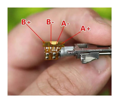 Close-up of a 5mm Planetary Gearbox For Stepper Motor With Precision Ball Bearing And Linear Slider Block, showing wire connections.