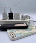 Universal Wall Charger Cube 5V 1A USB Power Adapter Fast Charge Plug for iPhone Samsung Galaxy LG and More Travel Ready Compact Charging Brick Single USB Port On The Go on power strip with smartphone cases.