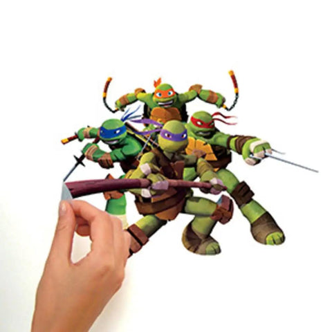 Teenage Mutant Ninja Turtles Peel And Stick Wall Decals Set Of 30 Stick On Wall Art For Kids Rooms Easy Peel And Repositionable No Residue Durable Vinyl Stickers Dope Bedroom Decor And Play Areas, hand applying turtle decal on wall.
