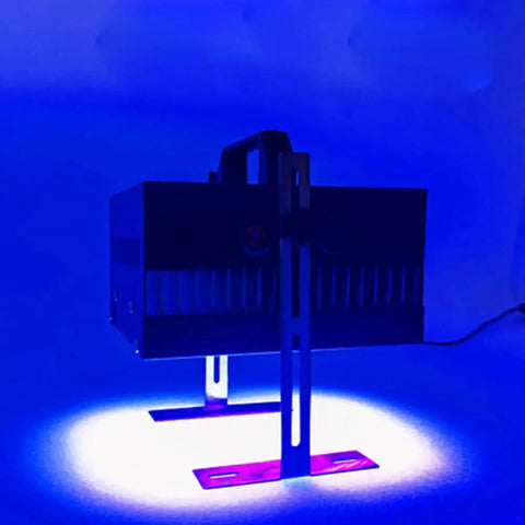 Heavy Duty UV Curing Lamp For Flatbed 3D Printers positioned on a work surface, emitting blue light for resin curing.