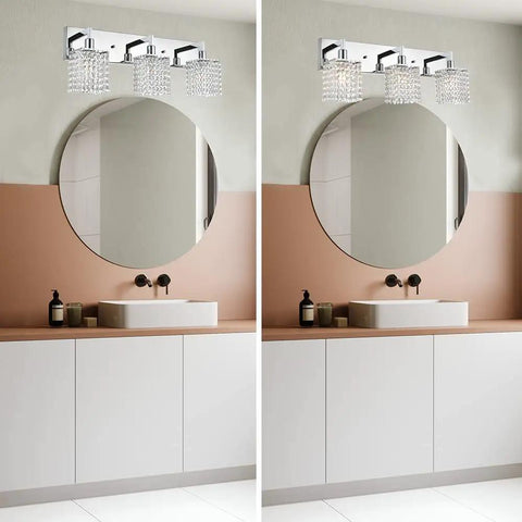 Three Light Crystal Vanity Light Fixture With Chrome Finish, above a bathroom mirror, modern crystal wall sconce lighting style.