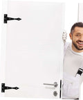 Smiling man holding a door with heavy duty cabinet door hinges visible
