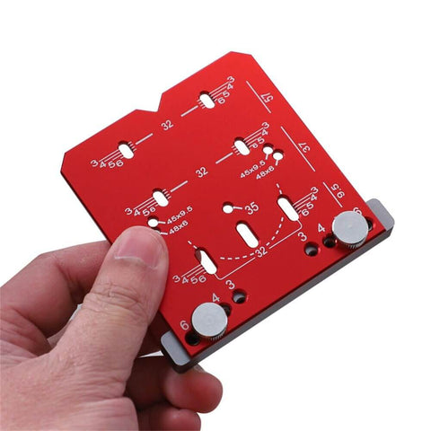 Universal Cabinet Hinge Jig With 35mm Drilling Guide and Adjustable Distance for Concealed Hinges in red, hand-held view