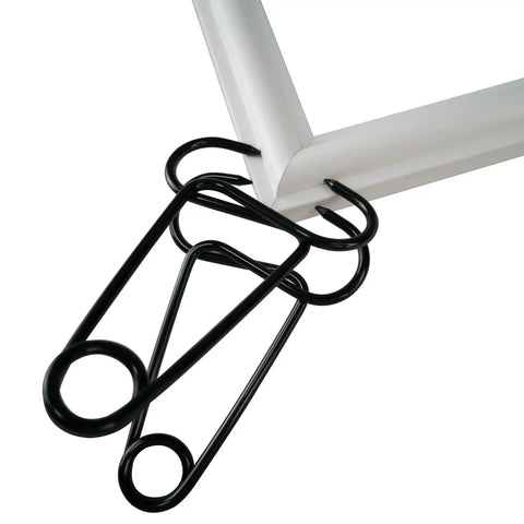 Pro Grade Miter Spring Clamps Pliers For Woodworking Set securing white mitered frame corner with heavy-duty black spring clamp