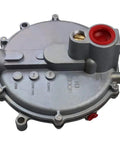 Top view of round metal low-pressure natural gas regulator with red gasket port and side fittings