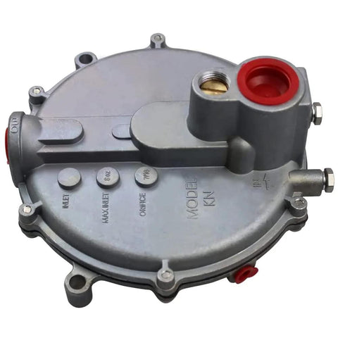 Top view of round metal low-pressure natural gas regulator with red gasket port and side fittings