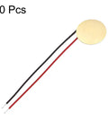 Close-up of Ten Pack 10mm Piezo Discs for Guitar Pickup Transducers with wire, ultra-thin brass disc, DIY acoustic part.
