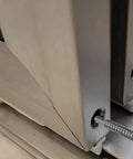 Close-up of Badass Stainless Steel Self Threading Screw inserted into framed shower door panel, securing aluminum track.