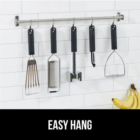 Dual Sided Meat Tenderizer Tool With Patented Design Beefy Heavy Duty Aluminum Mallet Soft Grip Handle With Hanging Hole displayed on rack