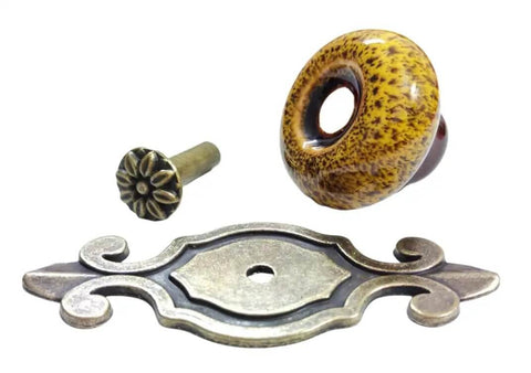 Slick 10 Pack Retro Ceramic Knobs With Sleek Petal Design For Fresh Kitchen And Bedroom Furniture Makeover No Fuss Diy Setup In Totally Rad Leopard Print Yellow, showing ceramic knob with yellow leopard print and metal base.