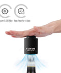 Two Pack Real Vacuum Wine Stoppers Keep Wine Fresh Longer in use on wine bottle, black color, showing vacuum effect.