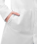 Close-up of pocket on Straight Up Crisp White Lab Coat For Nurses And Docs Featuring Hella Comfortable Tagless Fit.