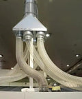 Shop Tested Heavy Duty Clear Flexible Dust Collection Hose 1 1/2 Inch By 20 Feet connected to a central filtration unit.