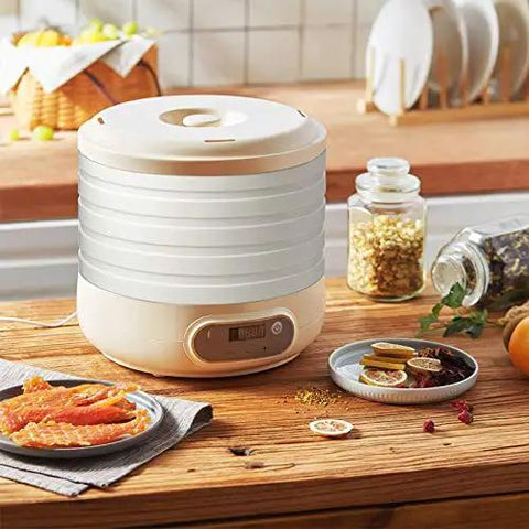 Compact Electric Food Dehydrator Machine For Fruit Jerky And Herbs With Five Stackable Trays Digital Timer Precise Temperature Dial on kitchen counter.