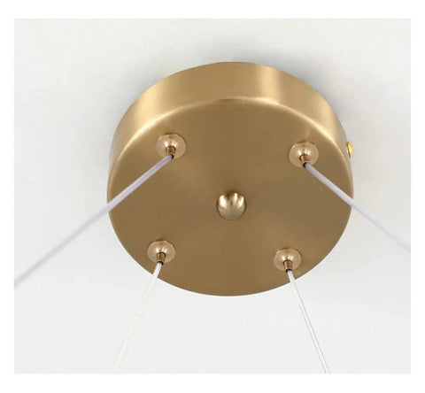Modern Stainless Steel Creative LED Pendant Lamp Luxury Living Room Restaurant Bedroom Hotel Minimalist Chandelier Decor Light ceiling mount with golden finish and supporting cables.