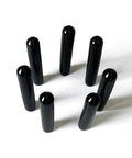 Black Screw Thread Protectors Pack Of 25 For One Quarter Inch Threads arranged in a circle, top view
