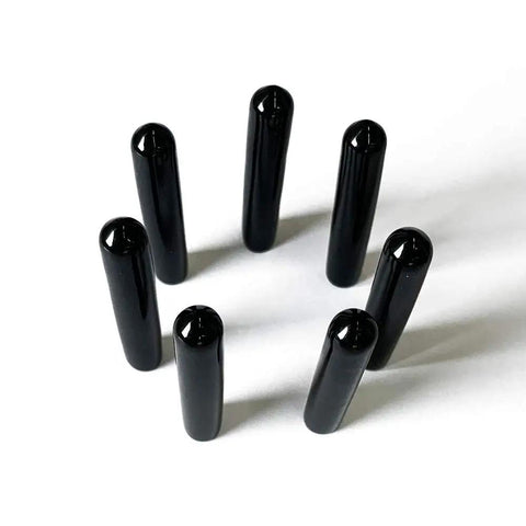 Black Screw Thread Protectors Pack Of 25 For One Quarter Inch Threads arranged in a circle, top view