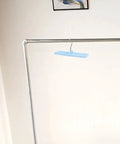 Sleek Belt And Tie Organizer Rack With Foldable Hooks Designed For Compact Closet Spaces Kick Your Wardrobe Into High Gear Keep Accessories Neatly Secured Easy Install Blue hanging from a metal rod.