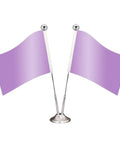 Two small purple tabletop flags on a silver stand with ball finials