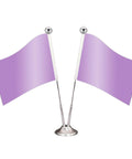 Two small table flags with light purple cloth on silver poles with round bases, displayed against a white backdrop.