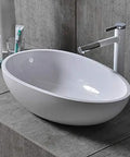 Real Deal White Oval Vessel Sink Built Tough From Dense Artificial Stone For Quick Countertop Installation With A Slick Finish. 610x440x160 mm.