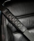 Premium Leather Seat Belt Cover For Tesla Cybertruck Featuring Quilted Smooth Surface on black seat with cushion