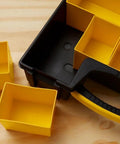 Deep Pro Organizer Tool Box With Locking Lid And Crystal Clear Cover, shown with removable yellow cup compartments on wood surface.