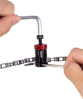 Person using Mini Bike Chain Cutter Tool For Quick Pin Removal And Link Breaking, Lightweight Aluminum Alloy Body.