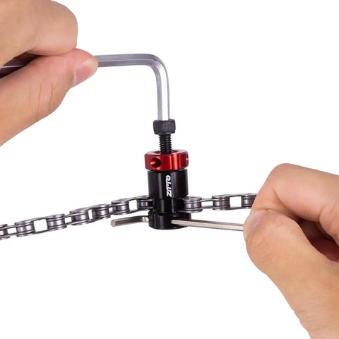 Person using Mini Bike Chain Cutter Tool For Quick Pin Removal And Link Breaking, Lightweight Aluminum Alloy Body.