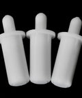 Close-up view of three white plastic spring loaded shutter louver replacement pins from the Twenty Piece Collection Of Spring Loaded Shutter Louver Replacement Pins Providing A No Sweat Upgrade For Fast Air Vent Repairs Using Heavy Duty Matte White Plastic Components.