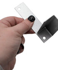 Person holding metal bracket from Ice Machine Water Valve Replacement Kit IH9121 000009121 With Brackets And Screws, 220/240V